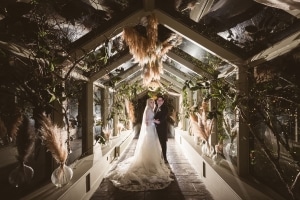 wedding-dress-backlit-glass-corridor