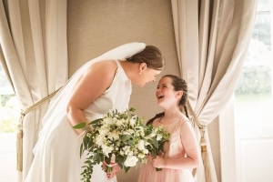 flowergirl-bride-bouquet-laughing