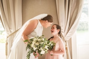 flowergirl-bride-bouquet-laughing